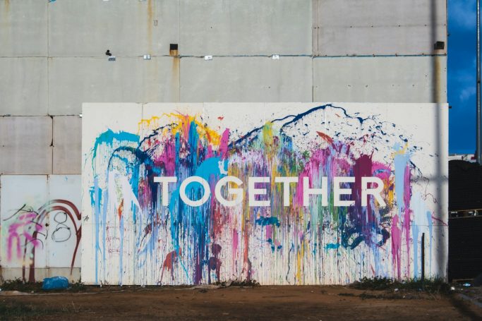 Colourful mural with the word "TOGETHER" prominently displayed.